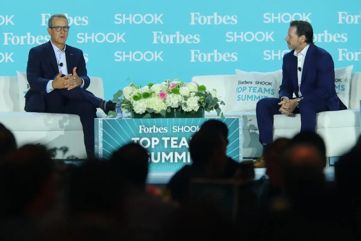 Wealth advisor on stage for discussion at industry event