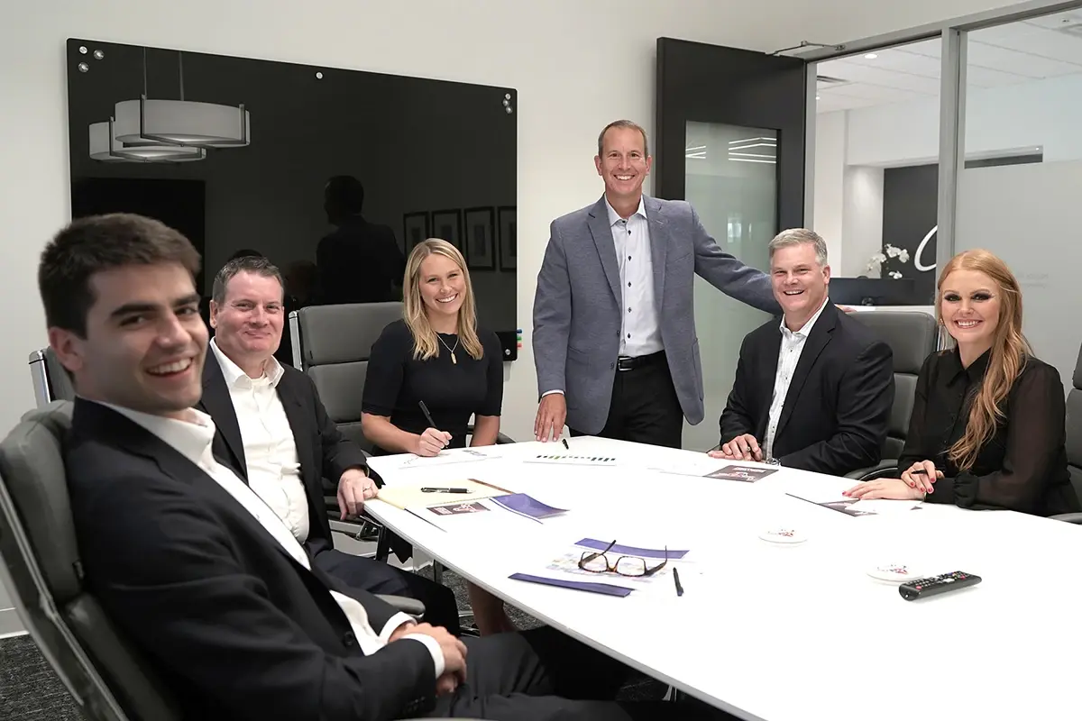 Wealth management team members in conference room Wealth management team members in conference room